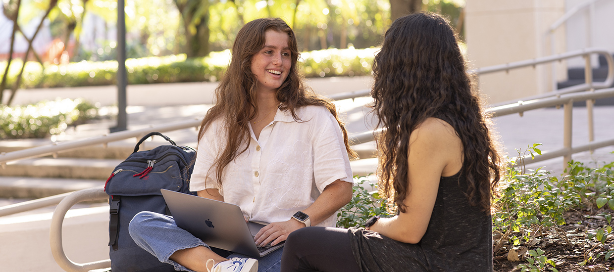 two students talking outside of class